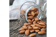 Image Almonds Spilling from a jar.